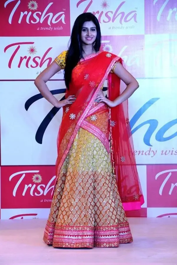 Actress Varshini Sounderajan In Traditional Red Half Saree